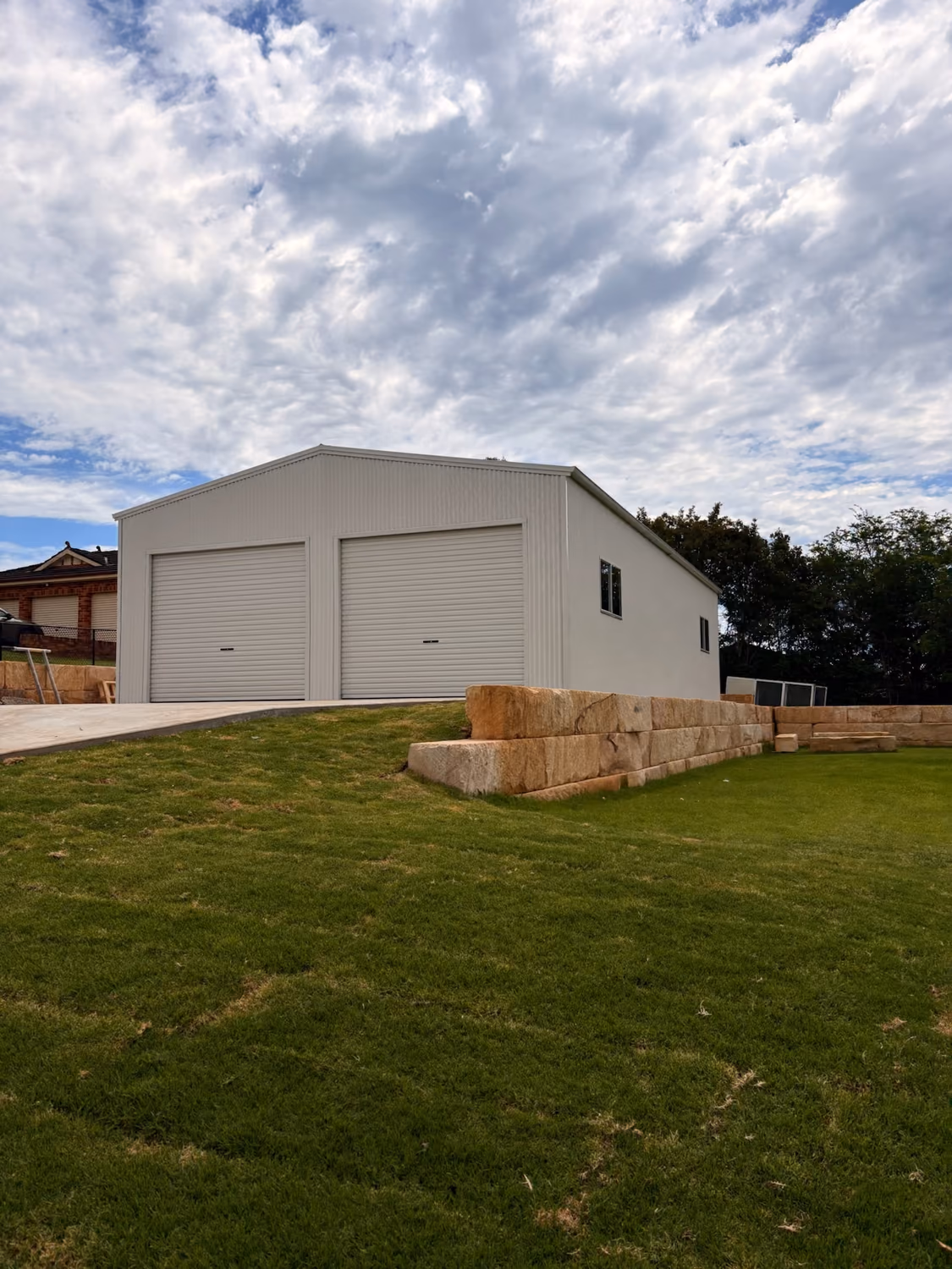 Double-door Colorbond shed with roller doors built by Formex Constructions in Western Sydney