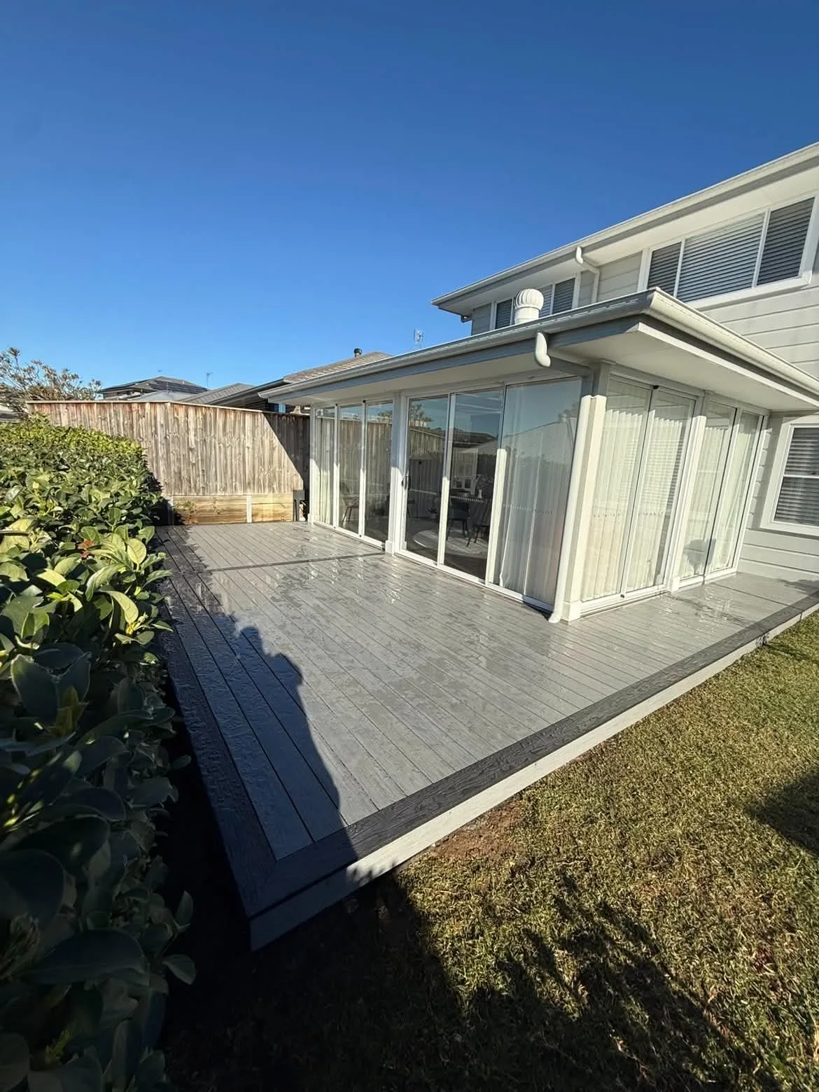 Grey composite timber deck running along the exterior of a Western Sydney home, built by Formex Constructions